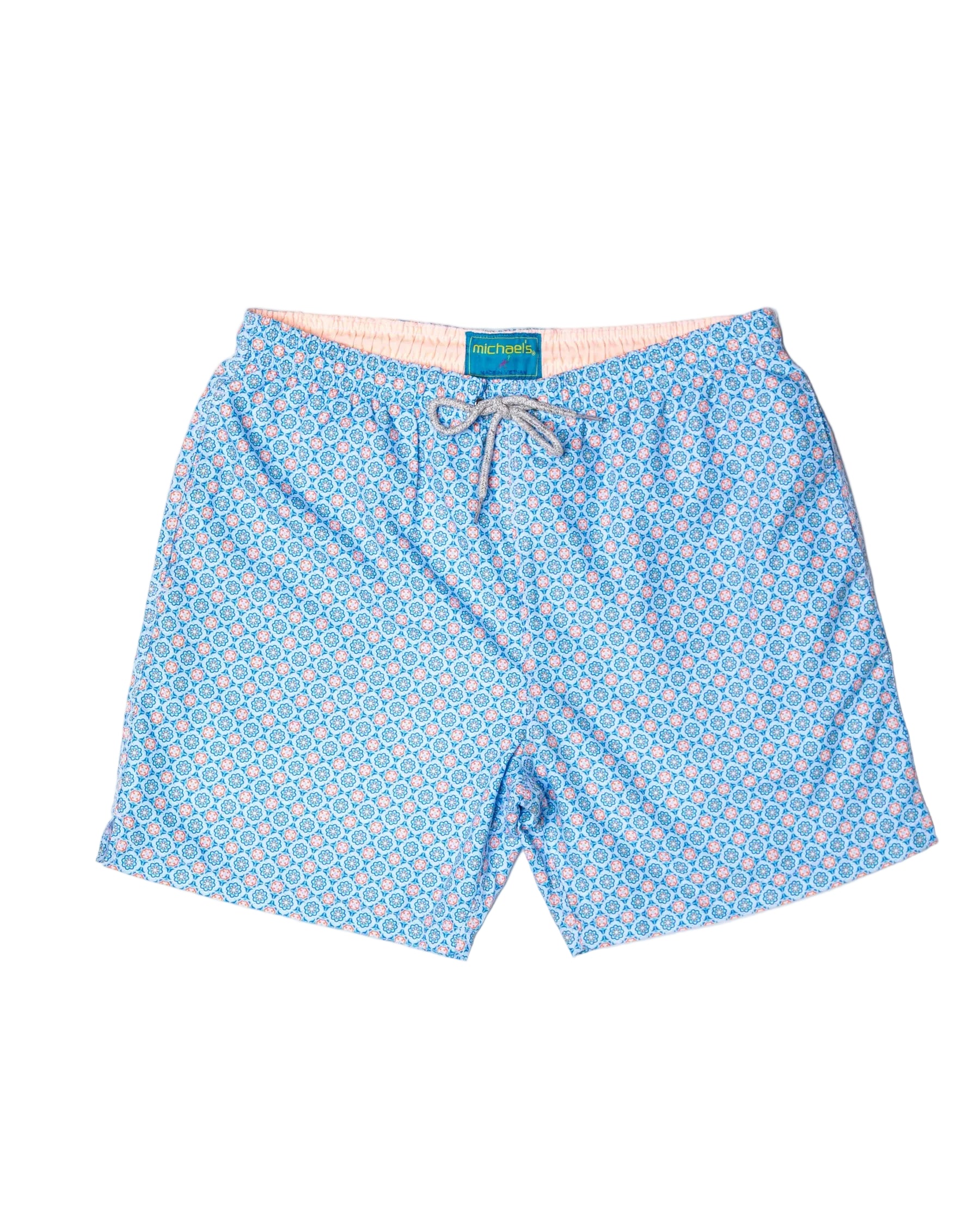 Blue patterned shorts with a michael's swim brand label on a white background