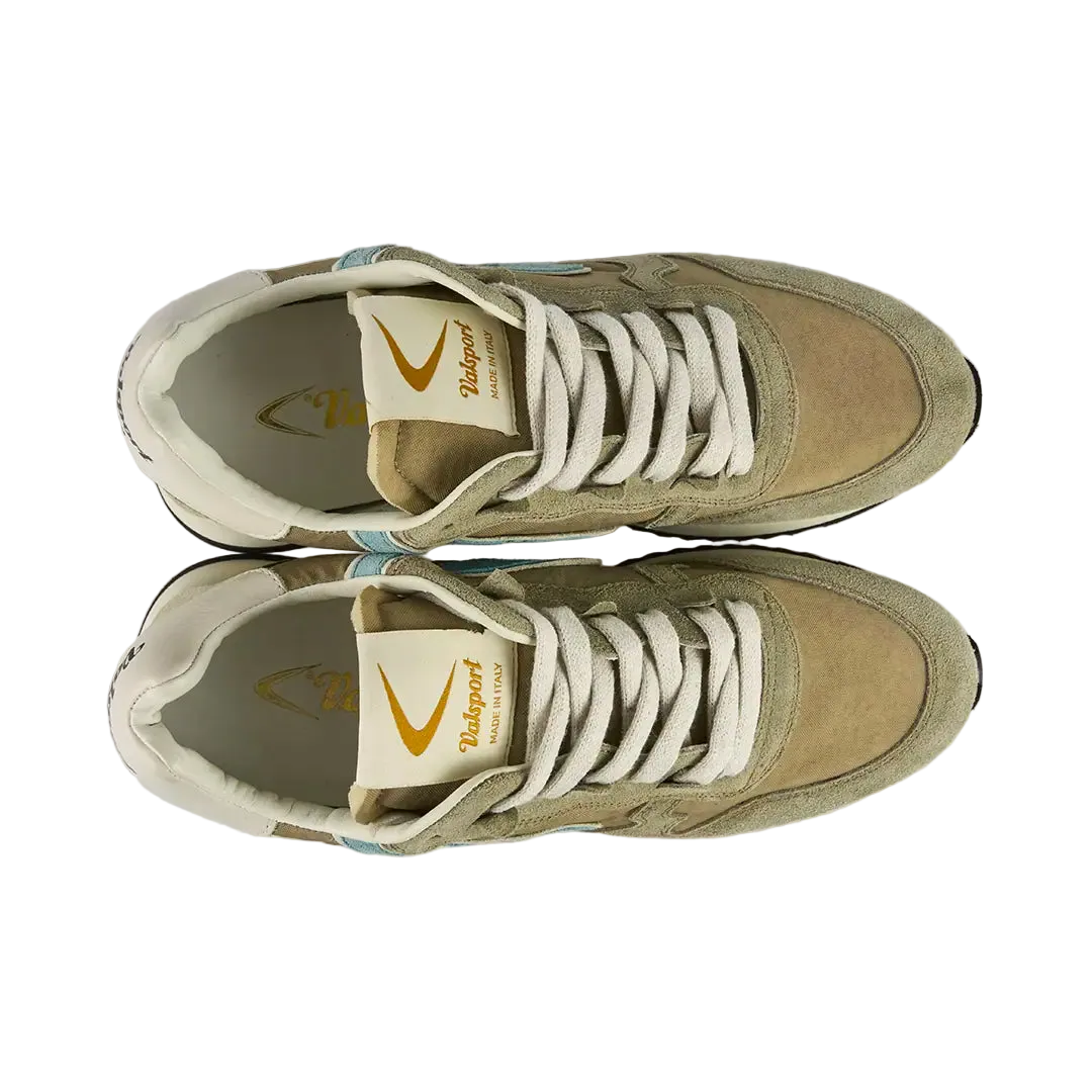 Pair of beige sneakers with white laces on a light gray background